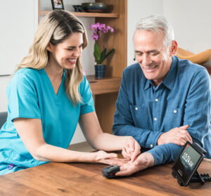 nurse measuring a resident's blood pressure