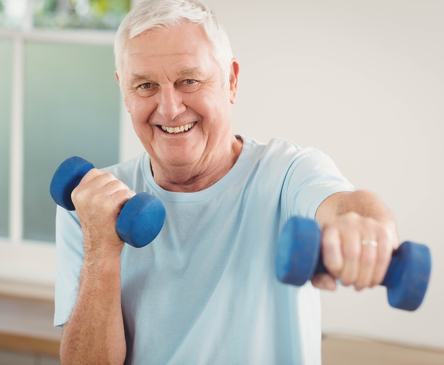 senior man doing arm exercises to stay healthy