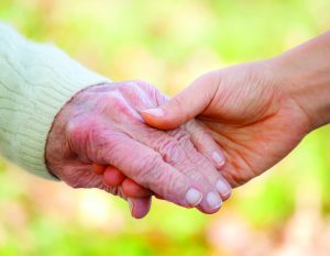 About Homeland At Home - holding hands image