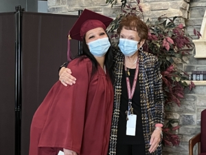 CNA Training Graduation graduate and teacher posing together